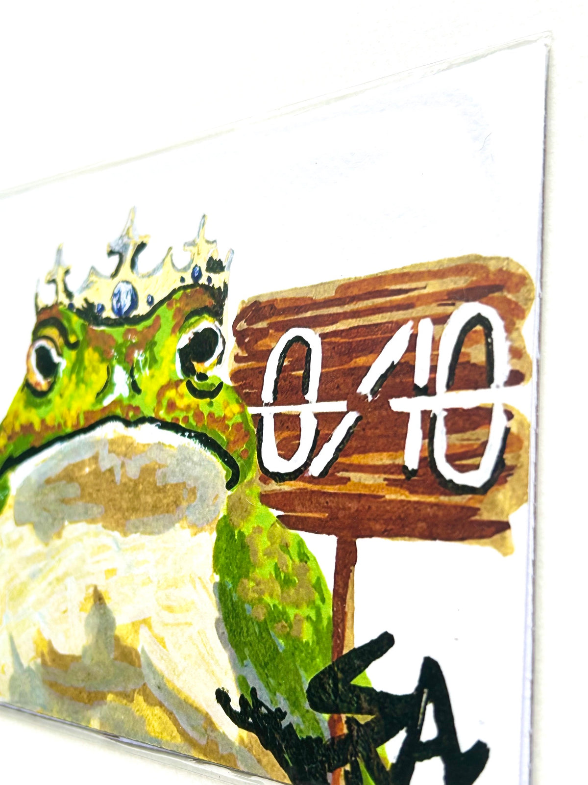 Angled close-up of 0/10 frog art print showing the crowned frog and 0/10 sign from the Chronicles of a Tired Frog collection