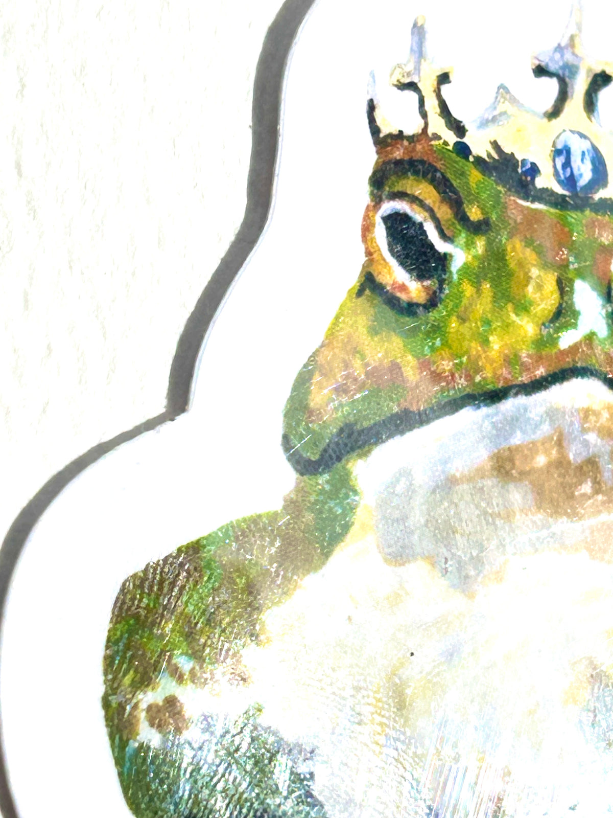 Side detail of 0/10 vinyl sticker showing the crowned frog artwork and painted texture