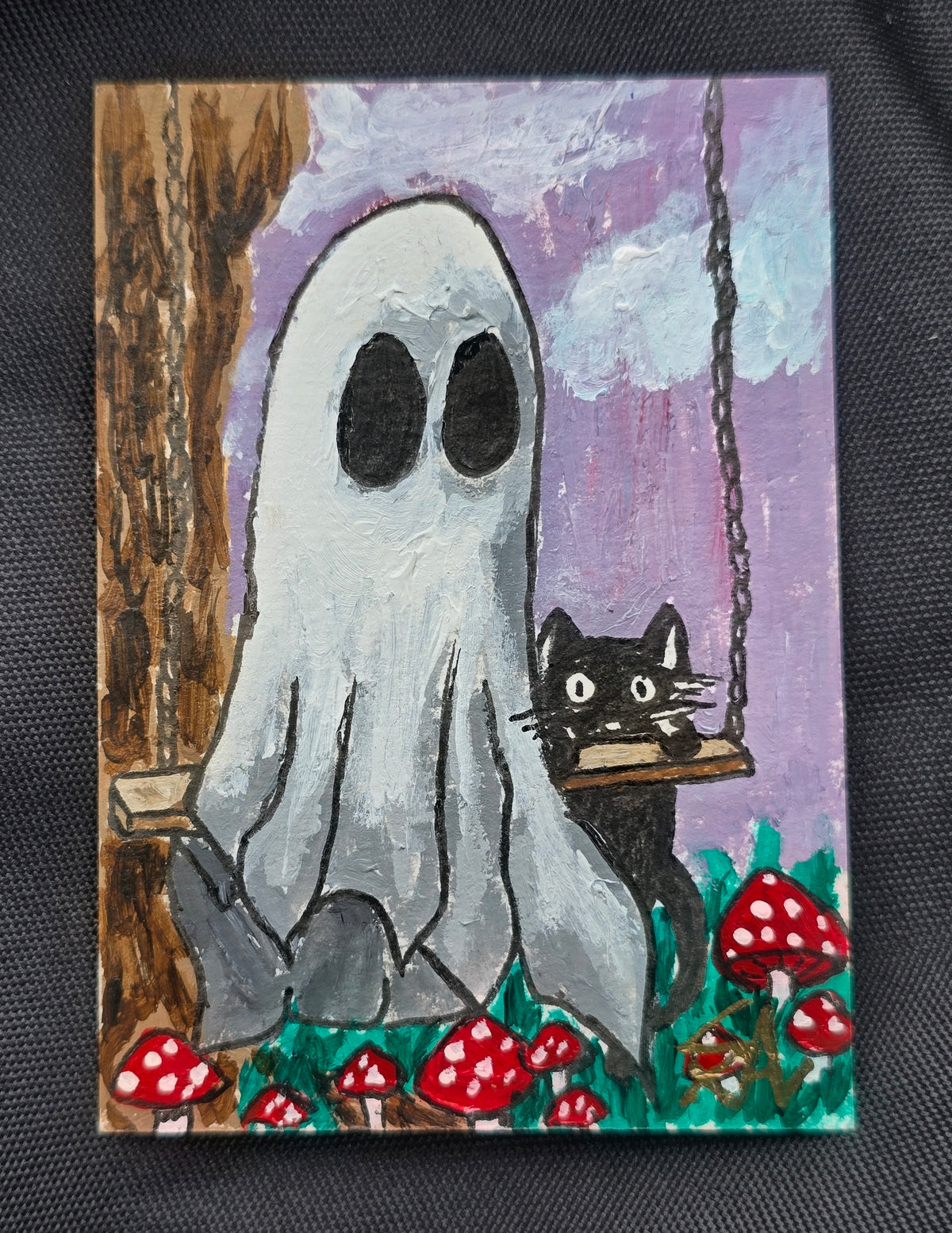 A Little Life After Death, original 2.5 x 3.5 inch painting of a white ghost beside a black cat on a swing, surrounded by red mushrooms.