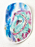 Astral Owl 3-inch holographic vinyl sticker featuring a colorful owl in turquoise, pink, and blue