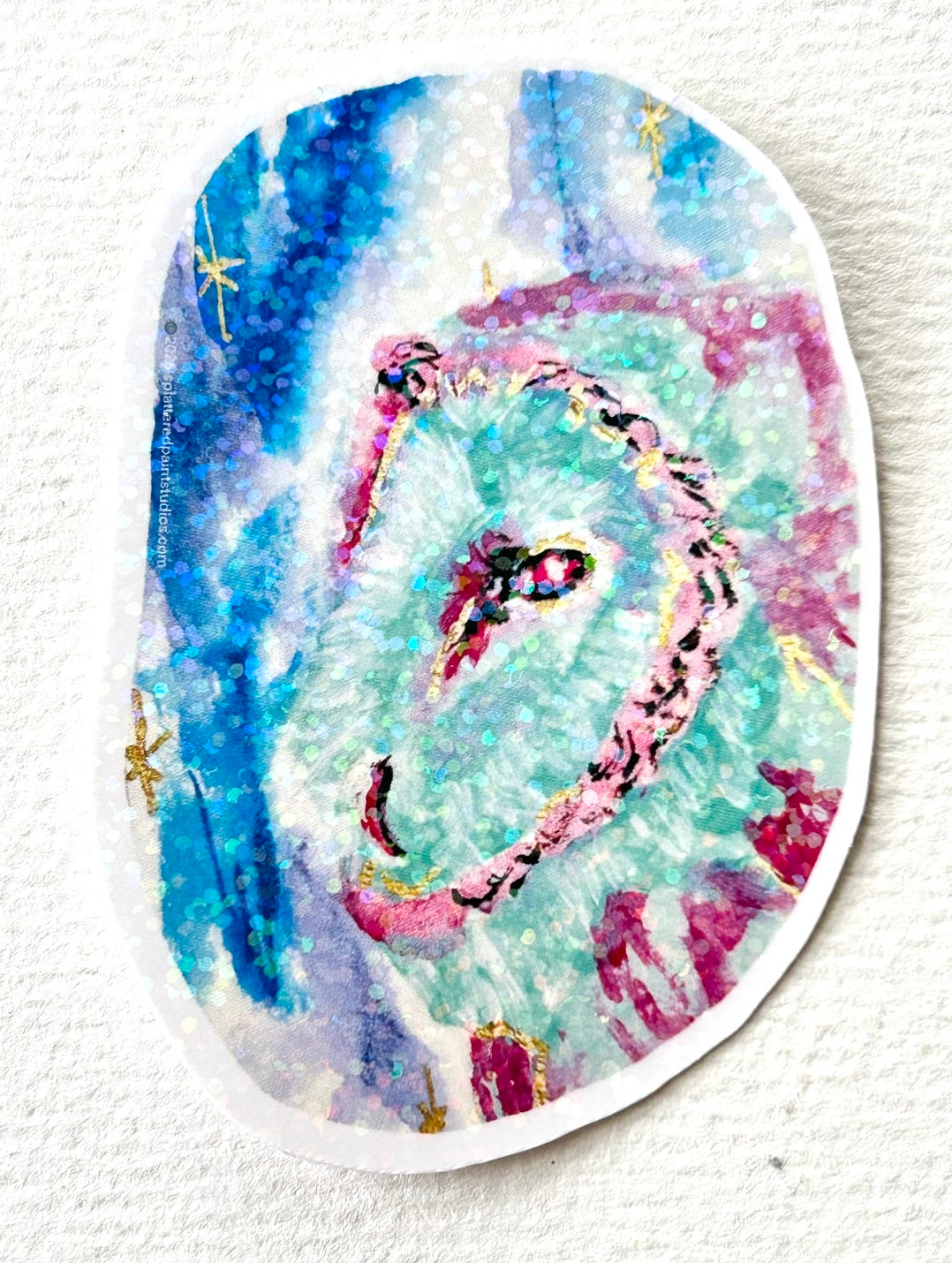 Astral Owl 3-inch holographic vinyl sticker featuring a colorful owl in turquoise, pink, and blue