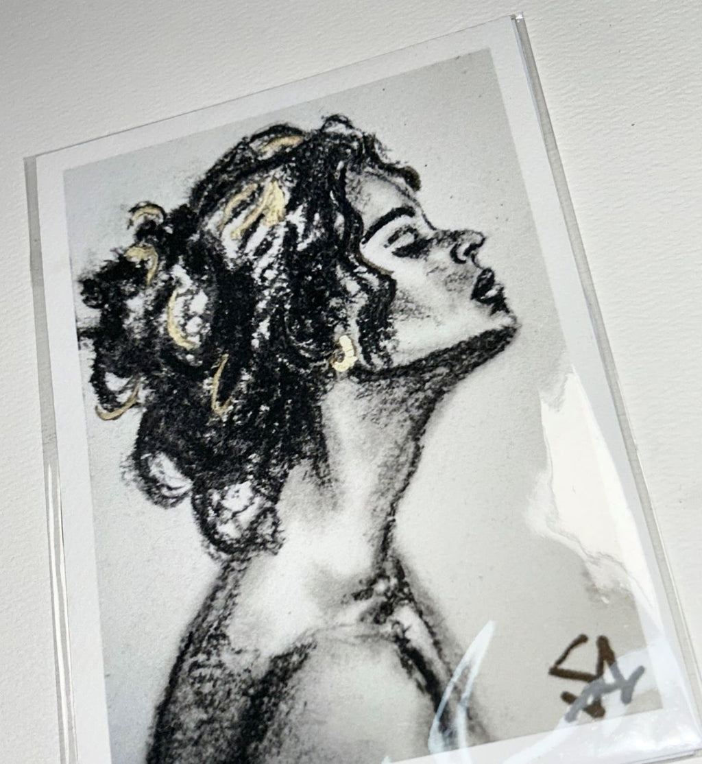 Close-up of Breath of Light 5x7 charcoal portrait print showing expressive texture and subtle gold accents