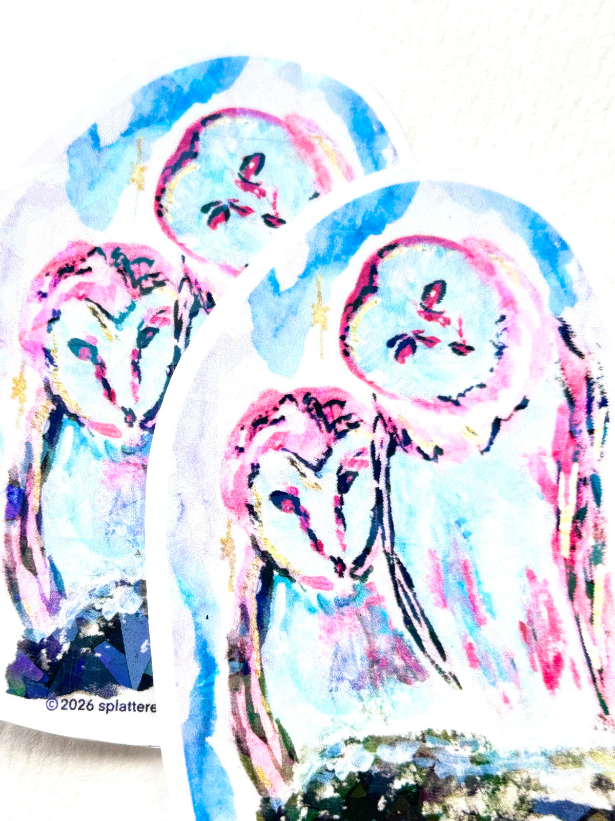 Two Celestial Keepers vinyl stickers featuring colorful blue and pink owl artwork