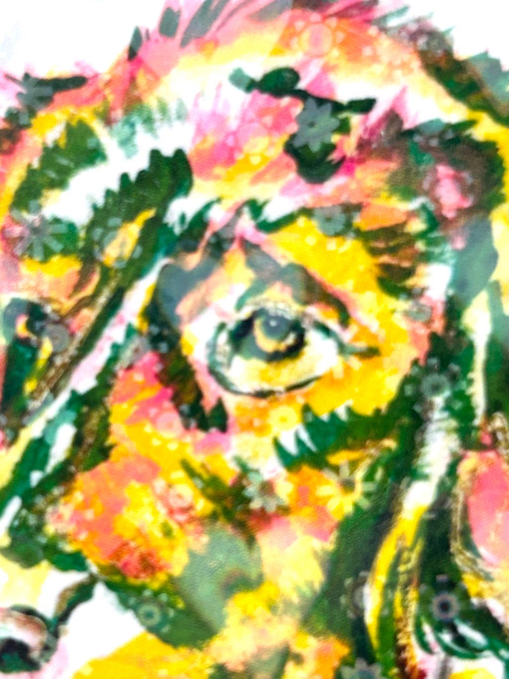 Close-up detail of Devotion holographic dog sticker showing vibrant pink, yellow, and green artwork