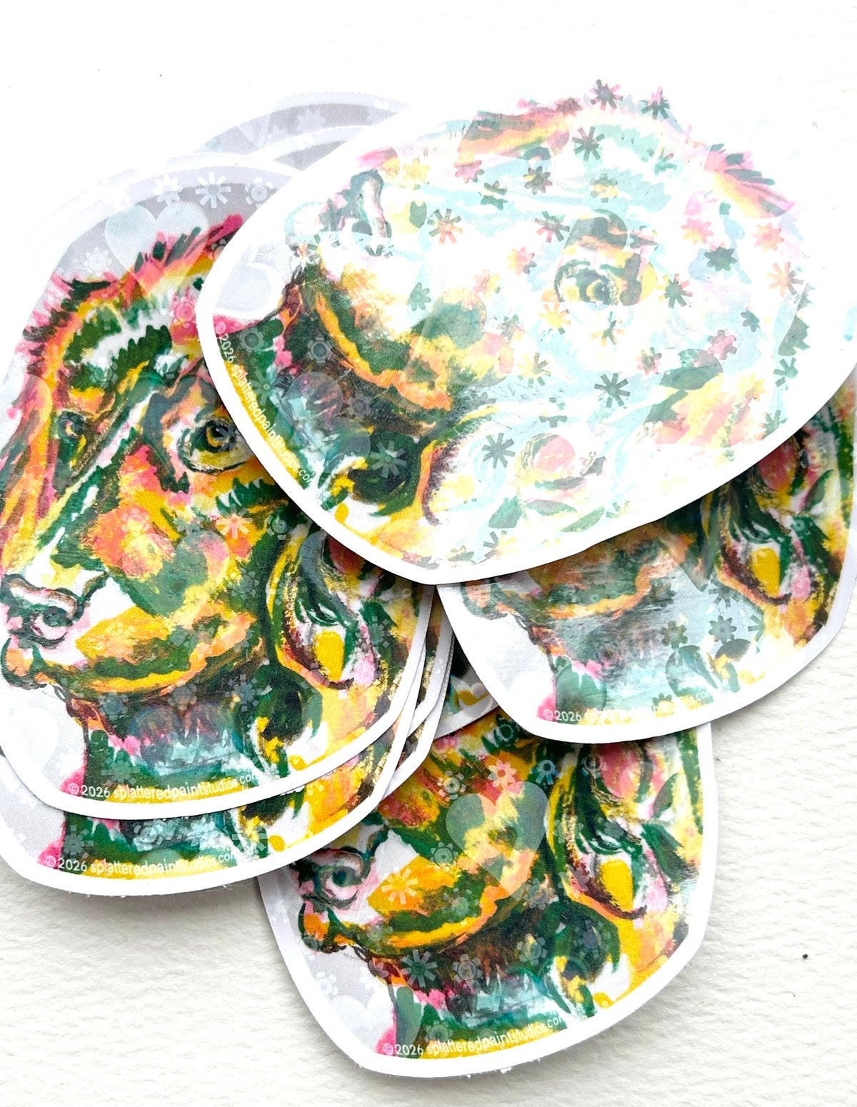 Stack of Devotion holographic vinyl stickers featuring colorful dog artwork from the Neon Familiars collection