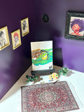 Don't Look At Me miniature frog artwork displayed in an art room