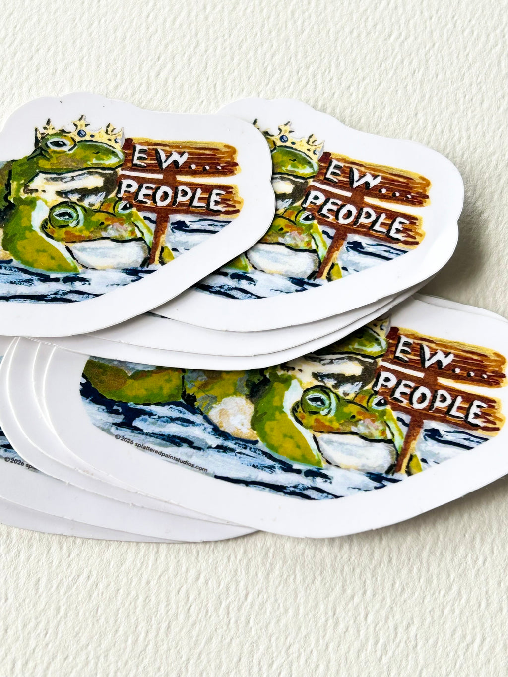Stack of Ew...People 3-inch vinyl stickers featuring two crowned frogs from the Chronicles of a Tired Frog collection