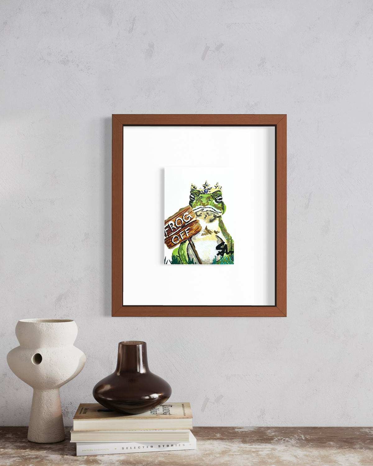 Frog Off 5x7 art print featuring a crowned frog displayed in a framed wall mockup