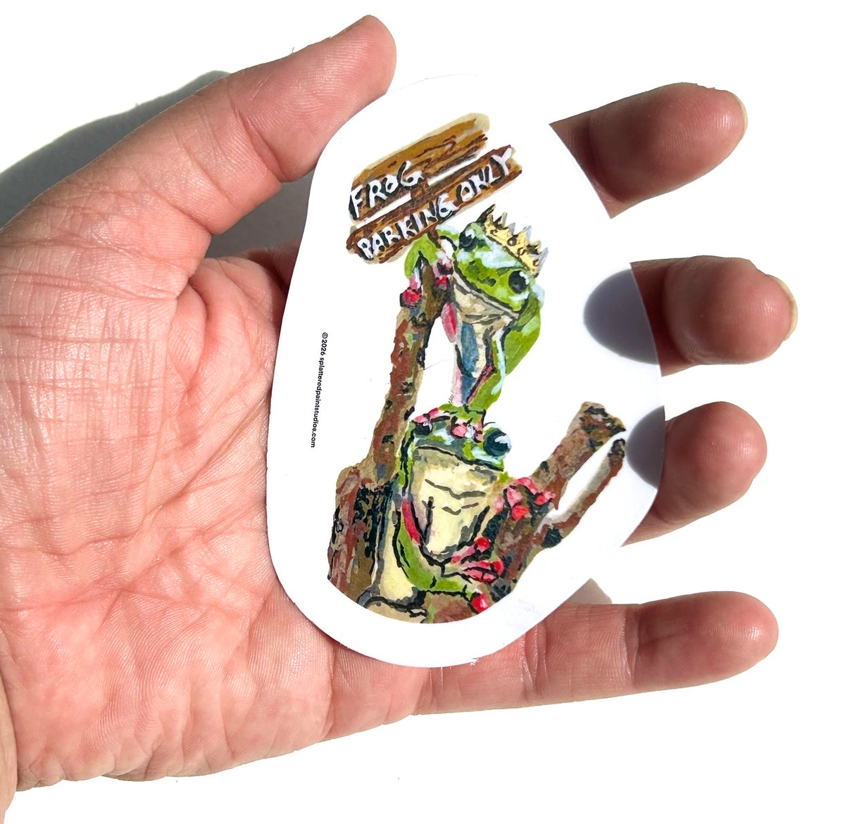 Frog Parking Only 3-inch vinyl sticker held in hand to show size and scale