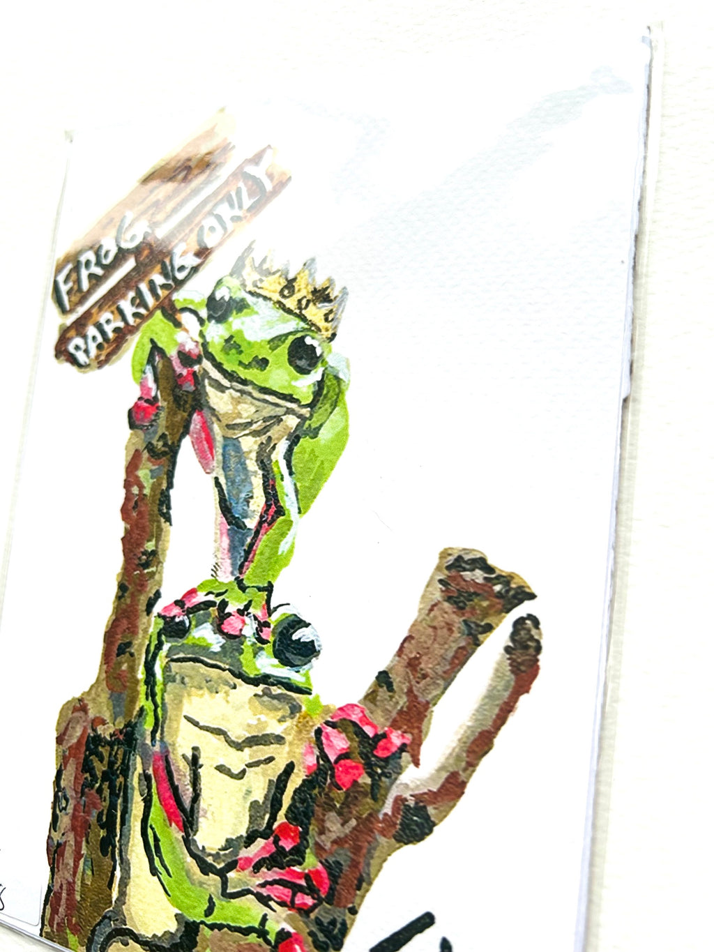 Angled view of Frog Parking Only 5x7 art print showing two crowned green frogs perched on branches