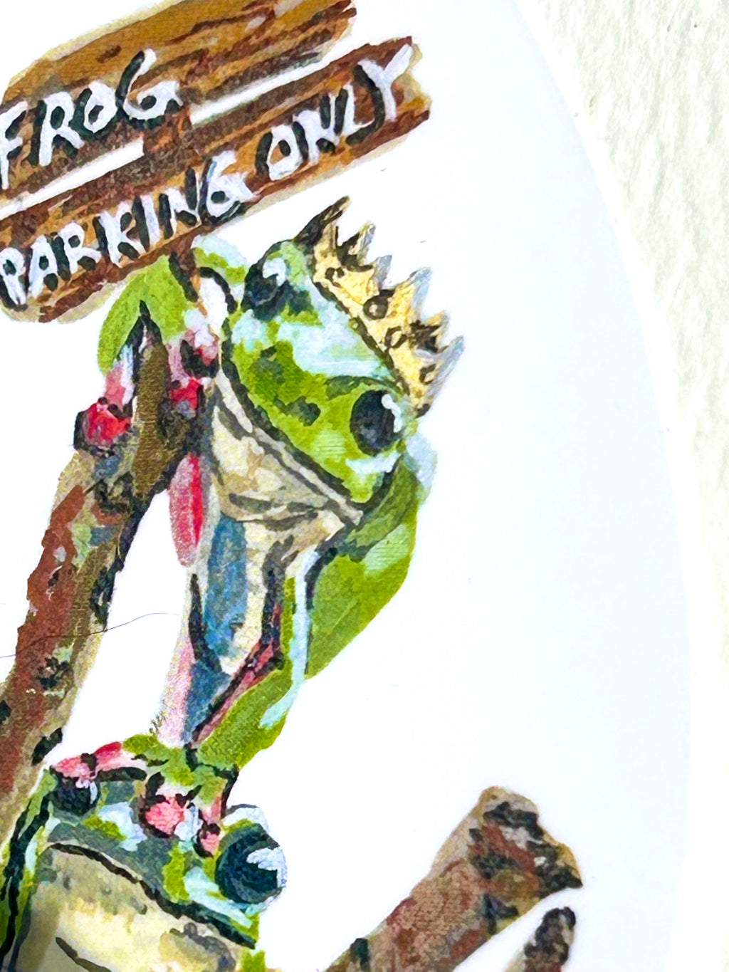 Close-up of Frog Parking Only vinyl sticker showing a crowned frog beside the Frog Parking Only sign