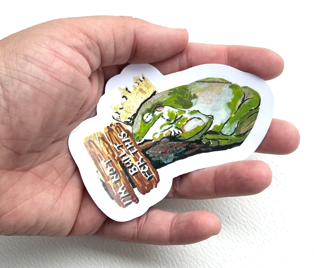 I’m Not Built for This 3-inch vinyl frog sticker held in hand to show size and scale