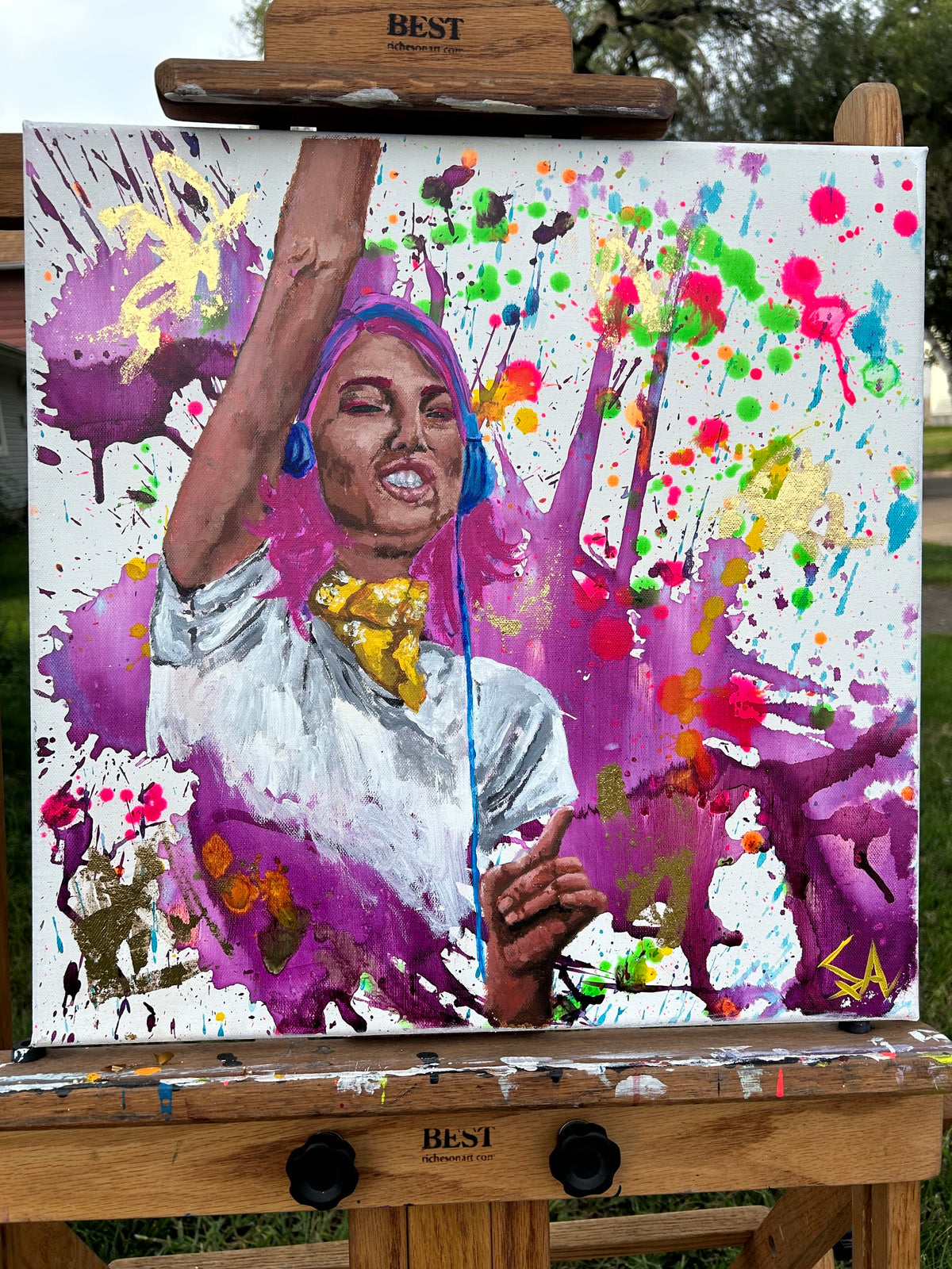 In Full Volume original 18x18 acrylic painting displayed on an easel during a live painting event