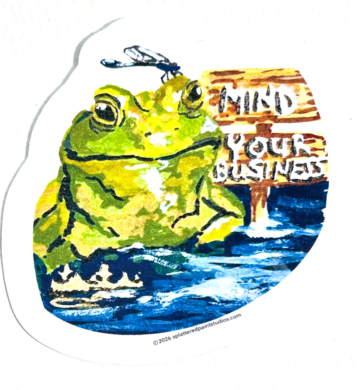 Mind Your Business vinyl sticker featuring a green frog in water with a dragonfly and wooden sign