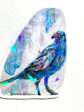 Nightflare 3-inch holographic vinyl sticker featuring a vibrant blue and purple bird with reflective geometric accents