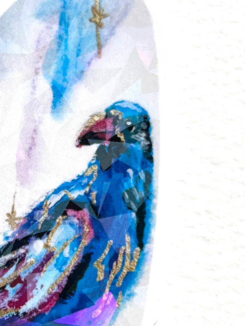 Detail view of Nightflare vinyl sticker featuring a vivid blue bird with purple and gold accents