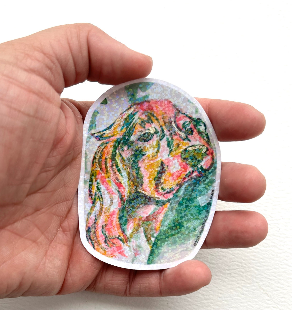 Open Trust 3-inch holographic vinyl dog sticker held in hand to show size and scale