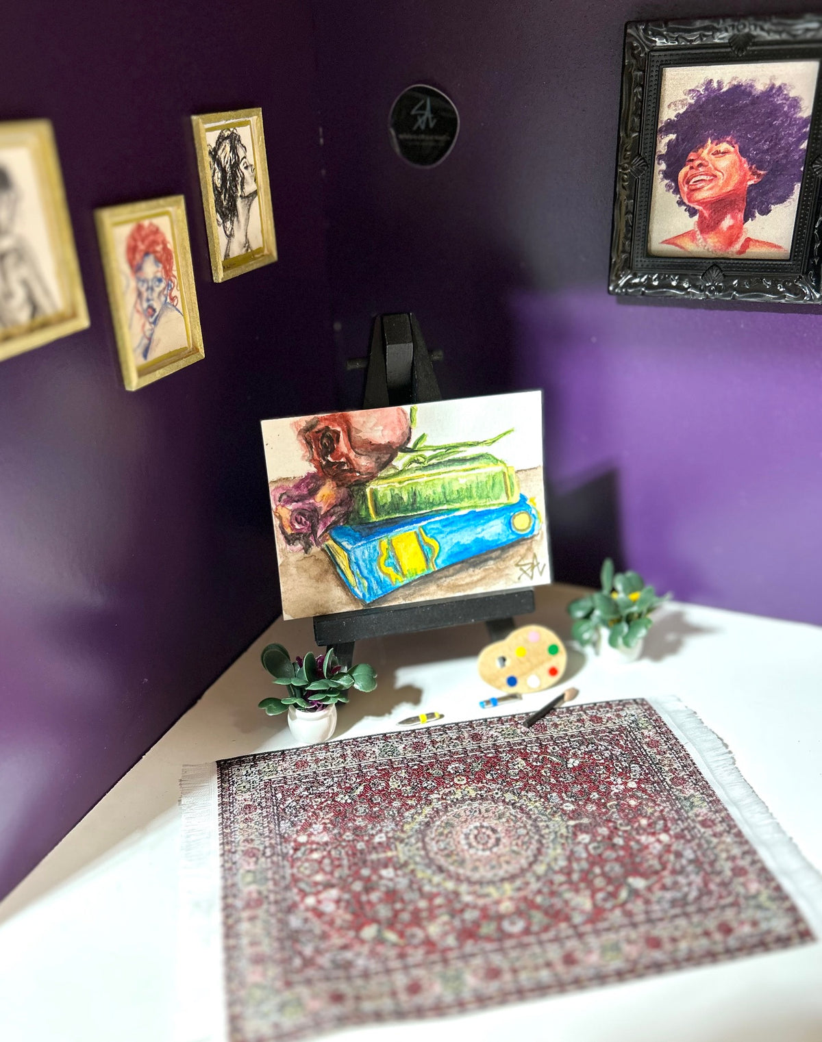 Pressed Between Pages miniature floral and book artwork displayed in an art room