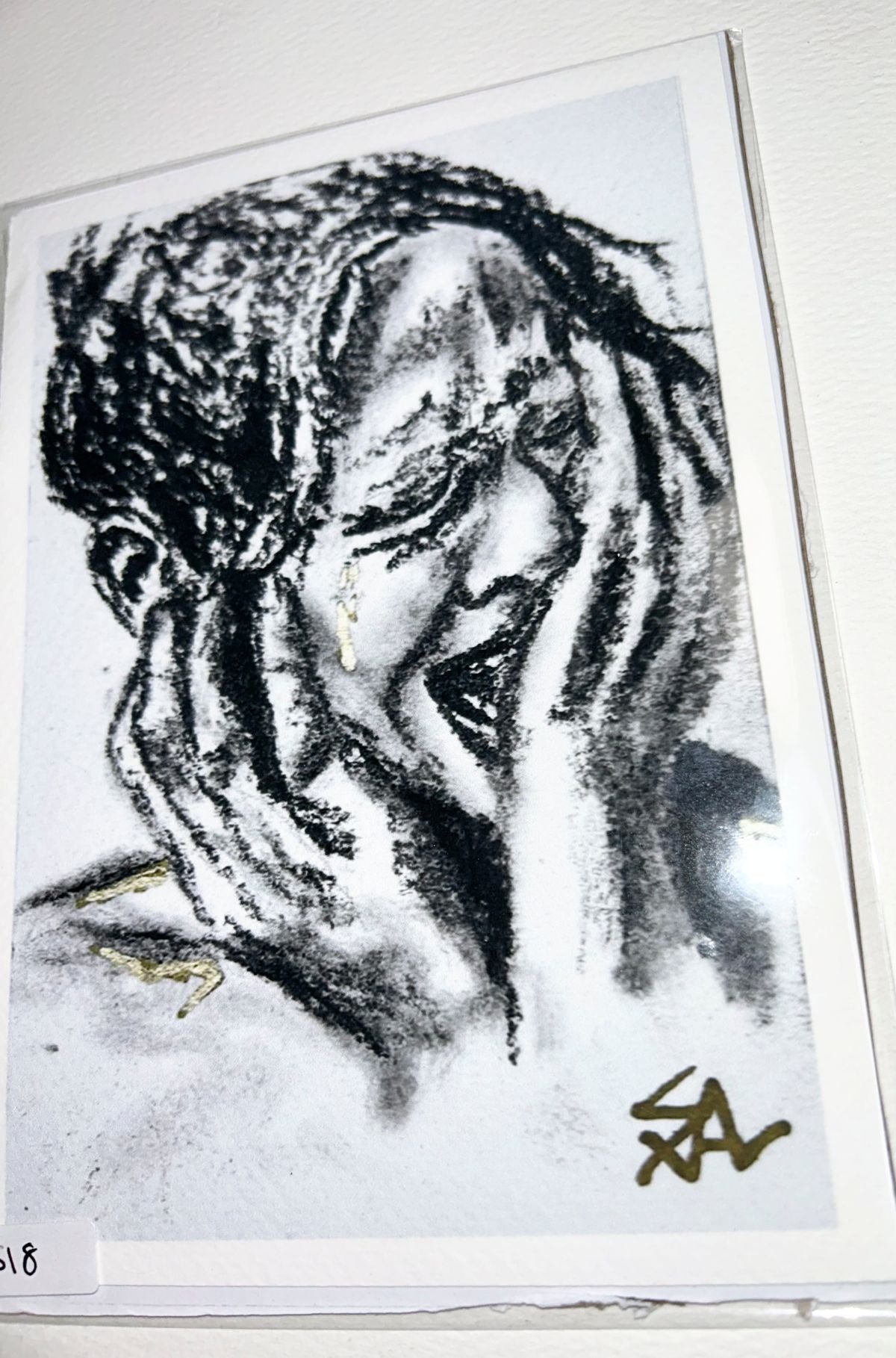 Close-up of Quiet Ache 5x7 art print showing an expressive black and white portrait with gold accents