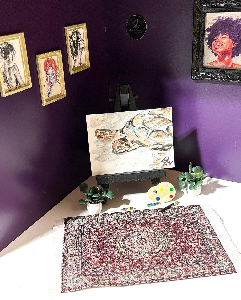 Quiet Reflection miniature sea turtle artwork displayed in an art room