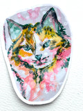 Radiant Stillness 3-inch holographic vinyl sticker featuring a colorful cat in pink, gold, and teal