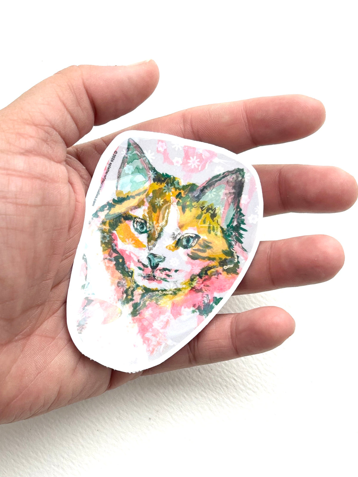 Radiant Stillness 3-inch holographic cat sticker held in hand to show size and scale