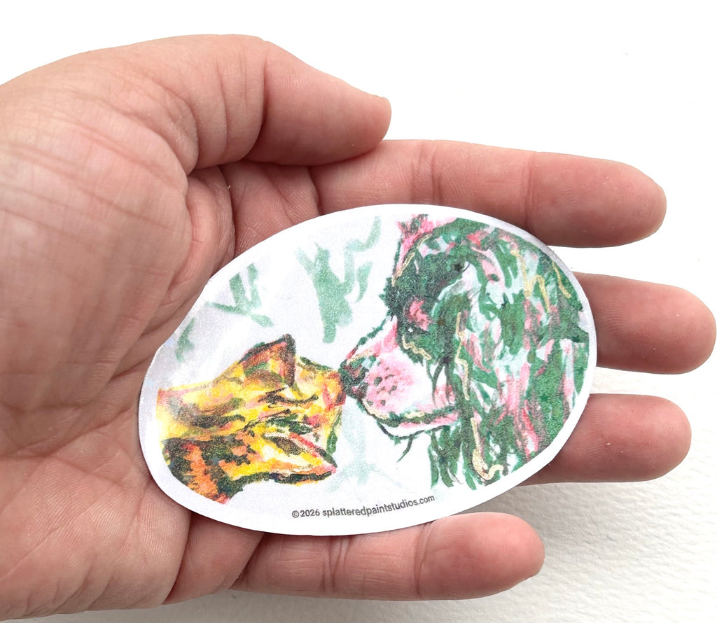 Recognition 3-inch holographic vinyl sticker featuring a cat and dog held in hand to show size and scale