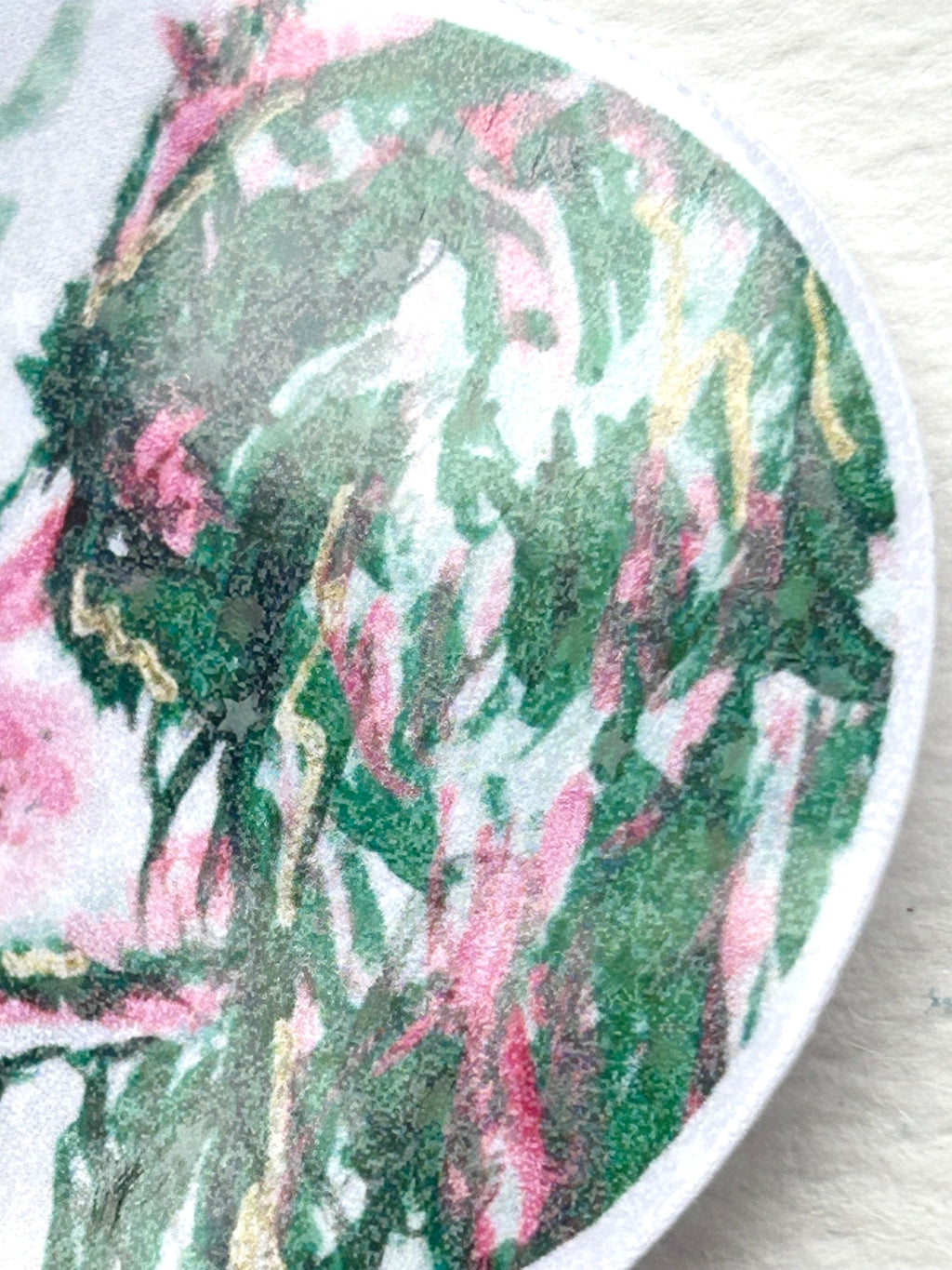 Close-up detail of the dog in the Recognition holographic vinyl sticker showing green, pink, and gold artwork