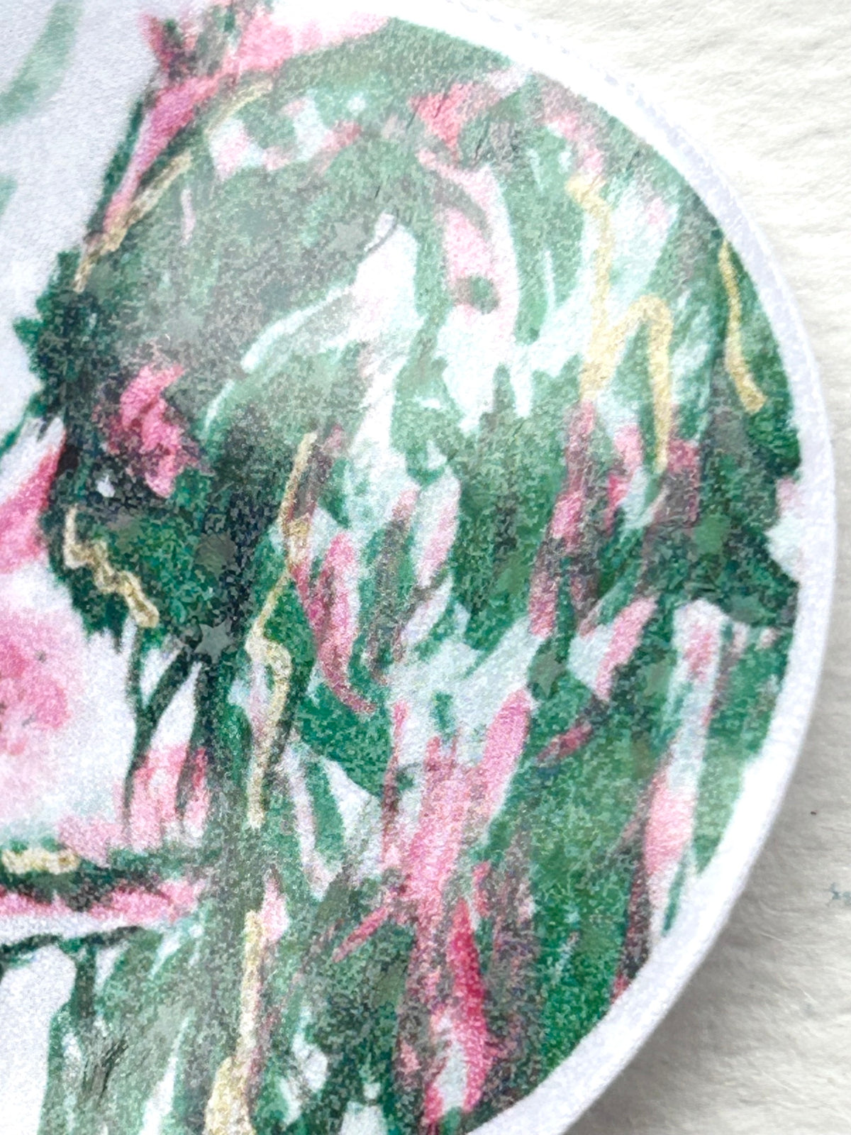 Close-up detail of the dog in the Recognition holographic vinyl sticker showing green, pink, and gold artwork