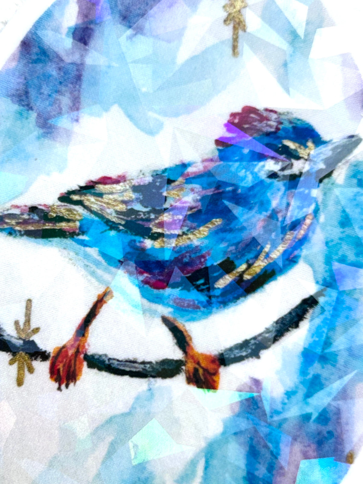 Close-up of Starglint vinyl art sticker showing the colorful blue bird and reflective geometric details