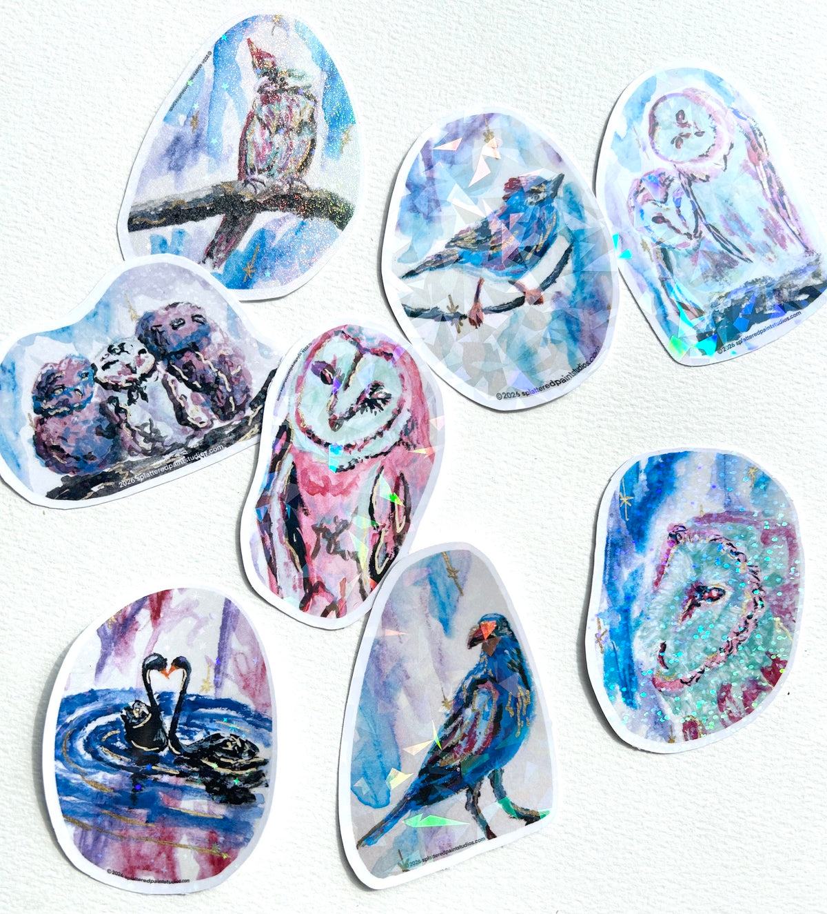 Assorted Starlit Aviary vinyl art stickers featuring colorful birds in expressive celestial designs