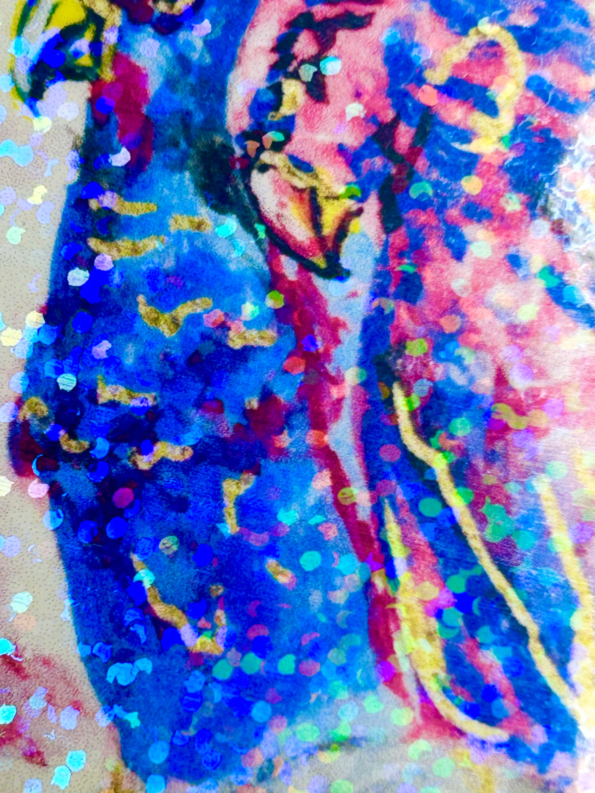 Close-up of Starwoven holographic vinyl sticker showing blue and pink bird artwork and reflective glitter finish