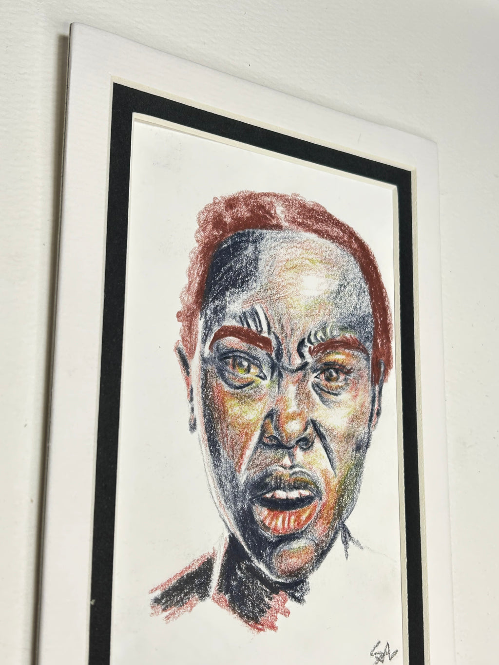 Angled view of The Last Word original colored pencil portrait displayed in a black and white 5x7 mat