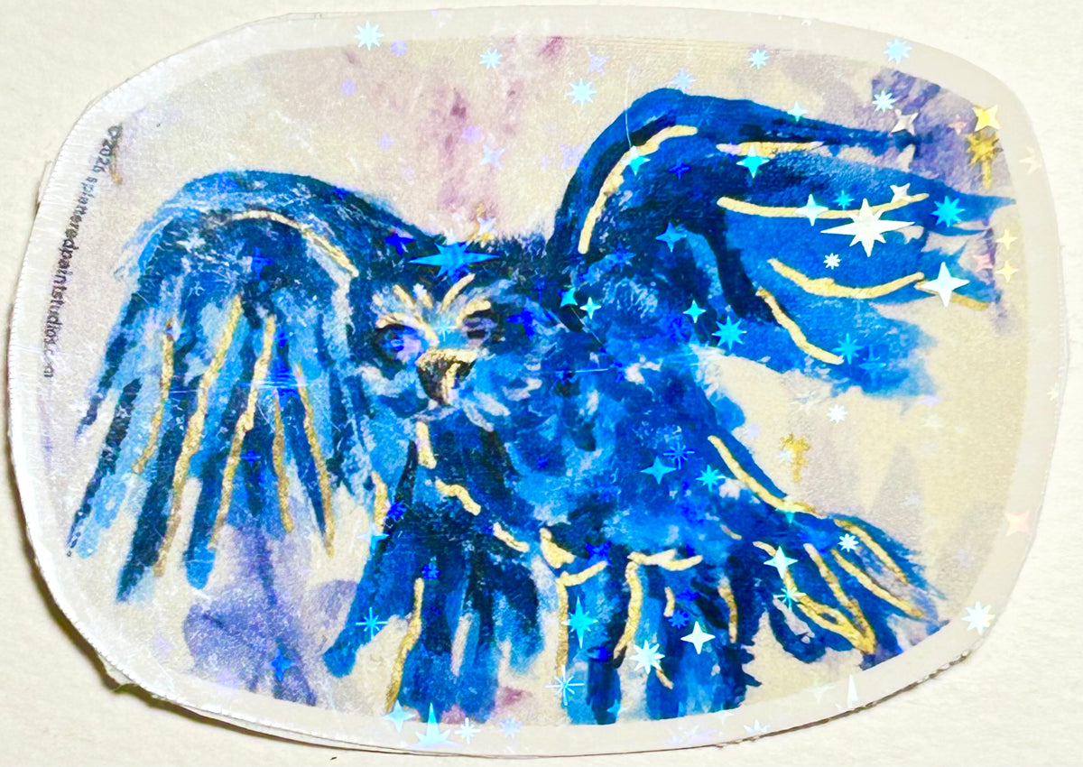 Close-up of Voiding Radiance laminated vinyl sticker featuring a blue bird with gold details and holographic stars.